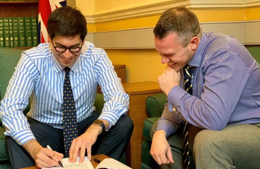 Ranil Jayawardena MP (left) and Revd Dr Chris Evans finishing and signing their application.